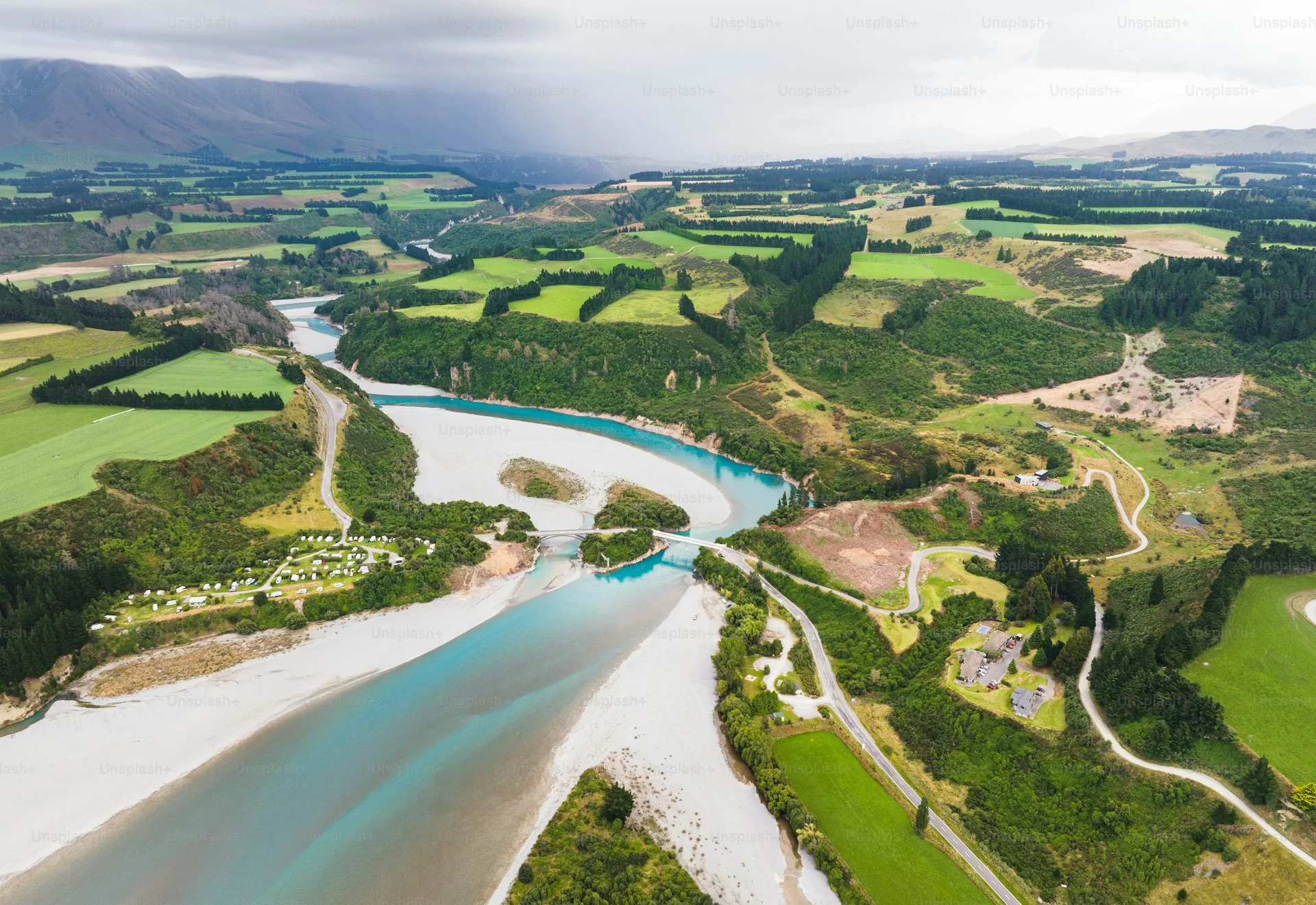 A garden wedding ceremony in Selwyn District with the Southern Alps visible on the horizon