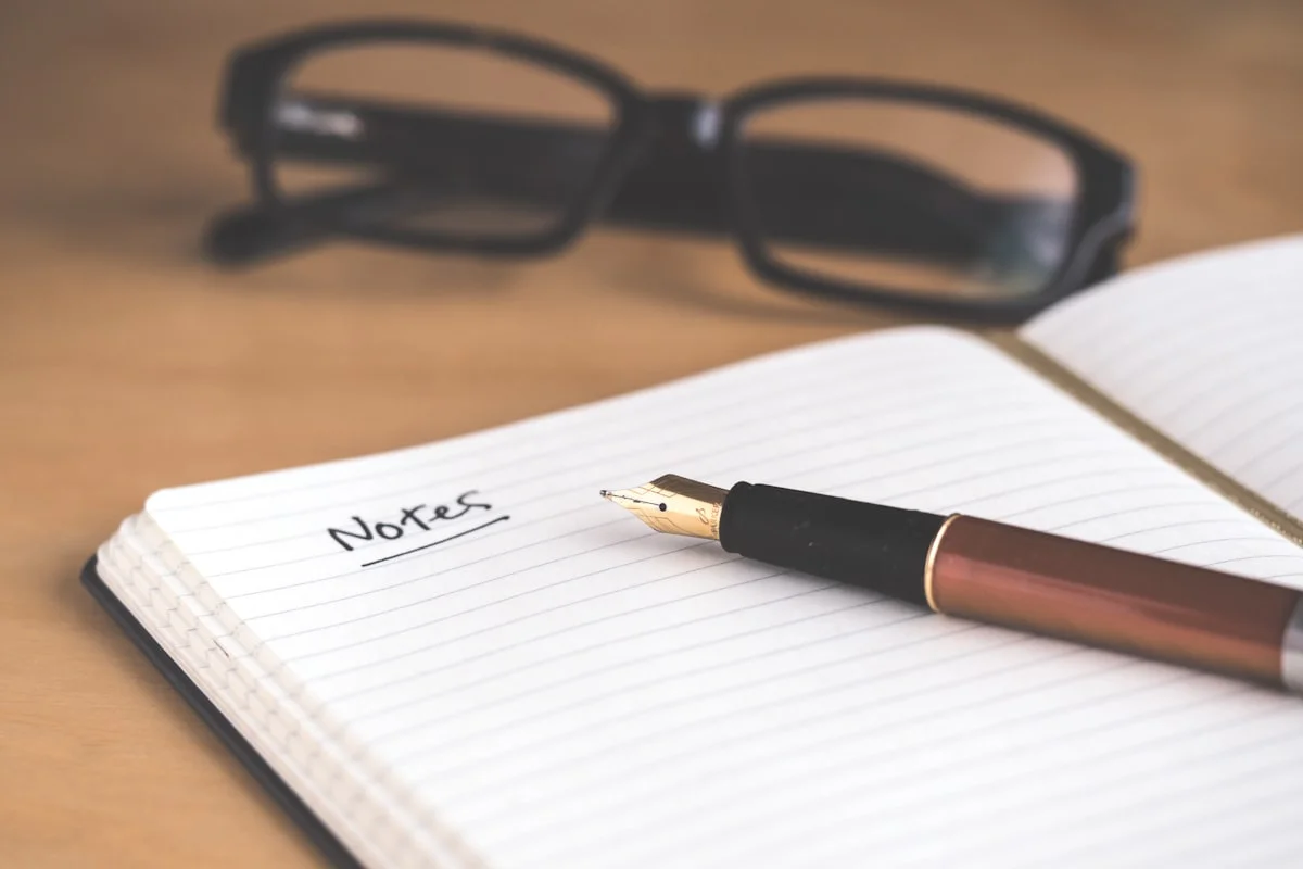 Handwritten notes on paper — the start of meaningful words